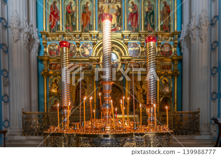 Orthodox Church Altar With Lit Candles and Gilded Iconostasis, Religious Worship Scene Orthodox Church Altar With Lit Candles and Gilded Iconostasis, Religious Worship Scene 139988777