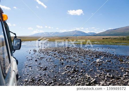 Off-road vehicles in remote region of Mongolia. Altai Tavan Bogd National Park Off-road vehicles in remote region of Mongolia. Altai Tavan Bogd National Park 139989372