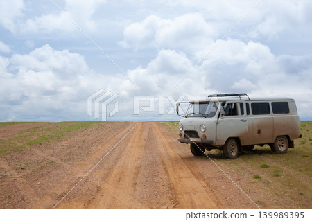 Off-road vehicles in remote region of Mongolia. Gobi desert area Off-road vehicles in remote region of Mongolia. Gobi desert area 139989395