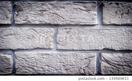 Light gray decorative stone brick wall texture background for facade cladding and interior architecture Light gray decorative stone brick wall texture background for facade cladding and interior architecture 139989631