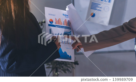 Accountants processing financial documents and taxes, managing corporate finance in a modern office. Audit and taxes in business Accountants processing financial documents and taxes, managing corporate finance in a modern office. Audit and taxes in business 139989709
