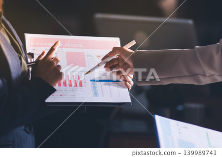 Accountants processing financial documents and taxes, managing corporate finance in a modern office. Audit and taxes in business Accountants processing financial documents and taxes, managing corporate finance in a modern office. Audit and taxes in business 139989741