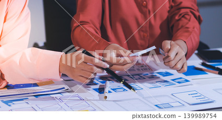 team of UI UX web designer are working together to develop mobile responsive websites with UI UX front end designer previews team of UI UX web designer are working together to develop mobile responsive websites with UI UX front end designer previews 139989754