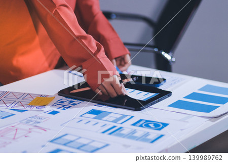 team of UI UX web designer are working together to develop mobile responsive websites with UI UX front end designer previews 139989762