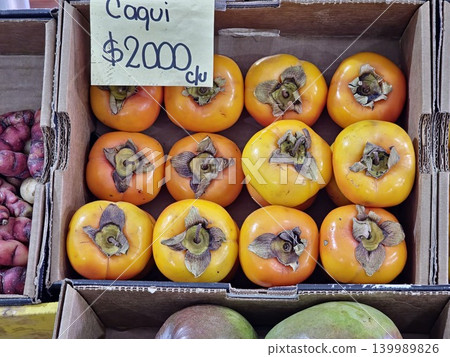 Cordoba, Argentina - April 9, 2026: persimmons displayed in fruit shop Cordoba, Argentina - April 9, 2026: persimmons displayed in fruit shop 139989826