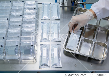 Pharmaceutical packaging process with sterile individual sachets being handled in a clean room Pharmaceutical packaging process with sterile individual sachets being handled in a clean room 139990066