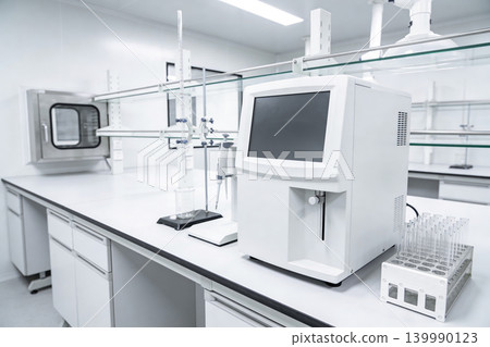 Modern laboratory equipment setup with analytical instruments and glassware Modern laboratory equipment setup with analytical instruments and glassware 139990123