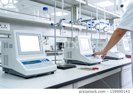 Modern laboratory equipment with digital displays and scientific instruments 139990143