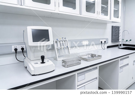 Modern laboratory equipment setup with advanced diagnostic tools and glassware 139990157