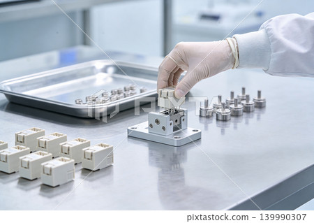 Precision assembly of electronic components in a cleanroom laboratory setting 139990307