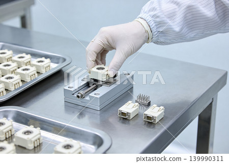 Precision assembly of electronic components in a cleanroom environment Precision assembly of electronic components in a cleanroom environment 139990311
