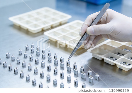 Precision assembly of electronic components in a cleanroom environment Precision assembly of electronic components in a cleanroom environment 139990359