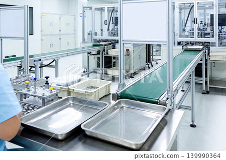 Automated assembly line in a cleanroom manufacturing facility Automated assembly line in a cleanroom manufacturing facility 139990364
