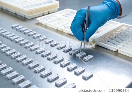 Precision assembly of small electronic components in a sterile laboratory environment Precision assembly of small electronic components in a sterile laboratory environment 139990384