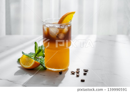 Cold bumble coffee with orange juice and ice Cold bumble coffee with orange juice and ice 139990591