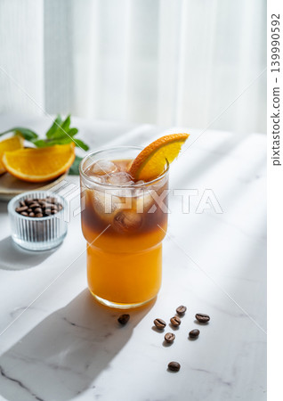 Cold bumble coffee with orange juice and ice Cold bumble coffee with orange juice and ice 139990592