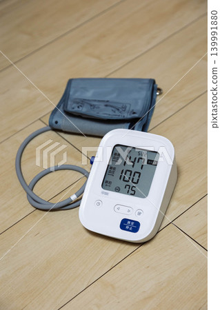 Blood pressure monitor indicates slightly high blood pressure. Blood pressure monitor indicates slightly high blood pressure. 139991880