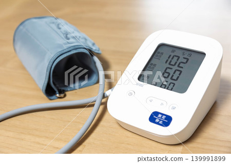 Blood pressure monitor indicates slightly low blood pressure. Blood pressure monitor indicates slightly low blood pressure. 139991899