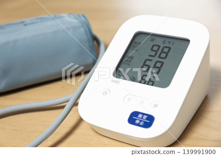 Blood pressure monitor indicates slightly low blood pressure. Blood pressure monitor indicates slightly low blood pressure. 139991900
