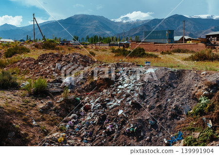 Illegal dumpster on field, Kyrgyzstan 139991904