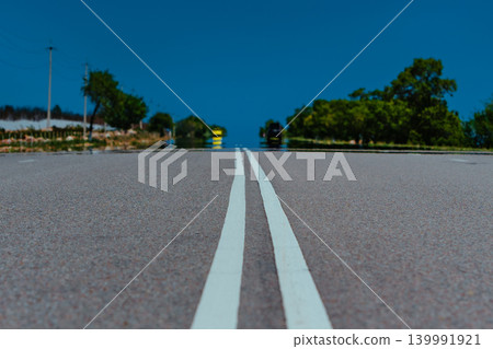 Road perspective with hot air making reflection on the road Road perspective with hot air making reflection on the road 139991921