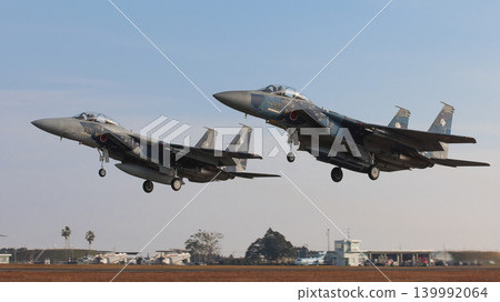 Japan Air Self-Defense Force F-15DJ Eagles taking off in formation Japan Air Self-Defense Force F-15DJ Eagles taking off in formation 139992064