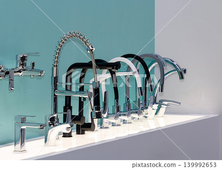Row of modern kitchen taps Row of modern kitchen taps 139992653