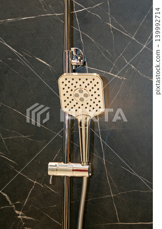Shower spray hanging in bathroom Shower spray hanging in bathroom 139992714