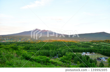 Mount Shari in June, surrounded by fresh greenery. Mount Shari in June, surrounded by fresh greenery. 139992895