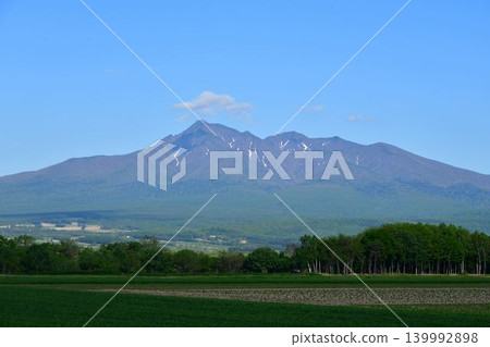 Mount Shari in June, surrounded by fresh greenery. Mount Shari in June, surrounded by fresh greenery. 139992898