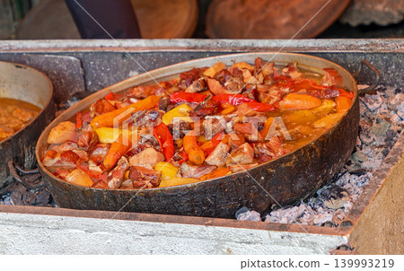 Vegetable stew in metal pot Vegetable stew in metal pot 139993219