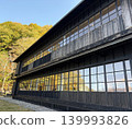 A beautiful historic Western-style building with black-painted wooden architecture. 139993826