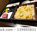 Steamed chestnut rice, a taste of autumn, in a piping hot bamboo steamer. 139993831