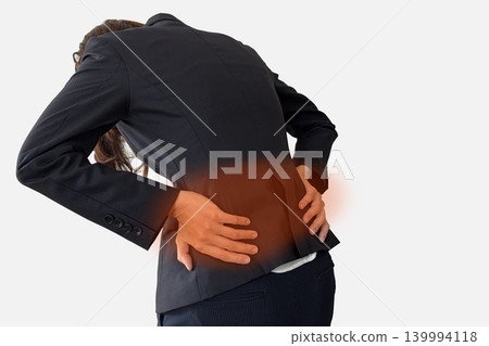 The image of a woman with back pain having a red lower back. The image of a woman with back pain having a red lower back. 139994118