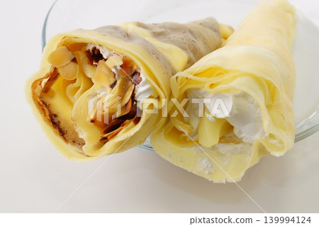 Almond chocolate crepe and peach crepe Almond chocolate crepe and peach crepe 139994124