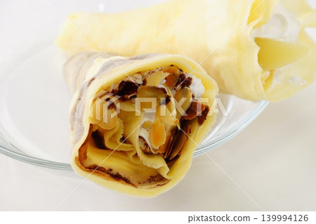 Almond chocolate crepe and peach crepe 139994126