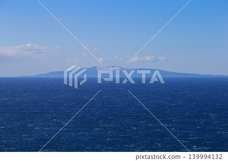 Oshima Island in a snowy landscape as seen from Minamiboso 139994132