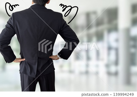 A salaryman tilts his head in confusion. A salaryman tilts his head in confusion. 139994249