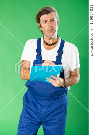 employee holds a folder with documents in hands against the background of chromakey employee holds a folder with documents in hands against the background of chromakey 139994831
