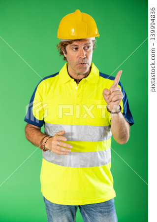 worker in reflective clothing tells the basic rules against the background of chromakey worker in reflective clothing tells the basic rules against the background of chromakey 139994836