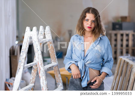 Young seductive woman posing in apartment during repair works Young seductive woman posing in apartment during repair works 139995033