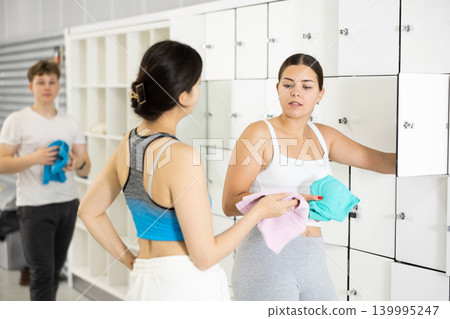 Women exchanged couple of phrases in ladies locker room after changing clothes 139995247