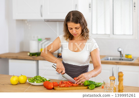 Woman cooking salad at home 139995261