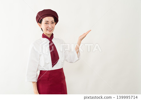 一位身穿麵包師制服的女子 一位身穿麵包師制服的女子 139995714