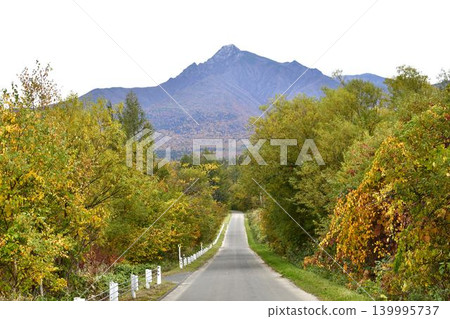 Autumn foliage in October and the road leading to Mt. Shari Autumn foliage in October and the road leading to Mt. Shari 139995737