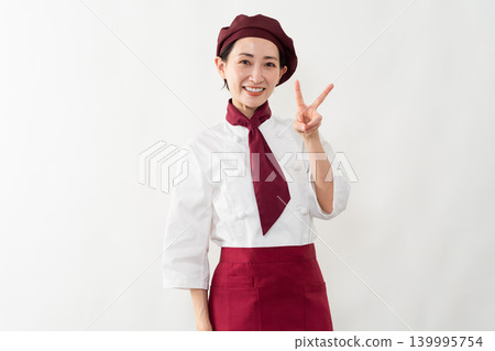 一位身穿麵包師制服的女子 一位身穿麵包師制服的女子 139995754