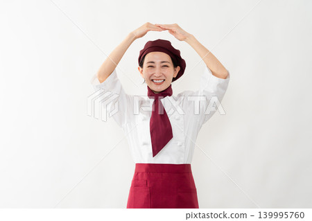 一位身穿麵包師制服的女子 一位身穿麵包師制服的女子 139995760