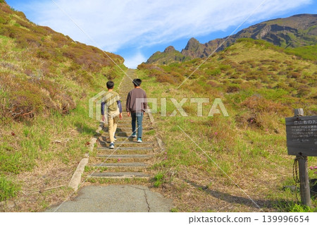 Brothers climbing the stairs at Sensuikyo Gorge Brothers climbing the stairs at Sensuikyo Gorge 139996654