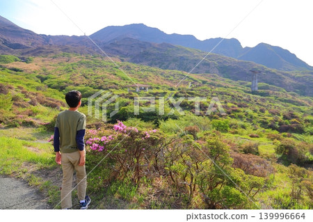A boy gazing at the mountains - Mount Aso A boy gazing at the mountains - Mount Aso 139996664