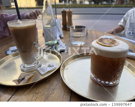 Enjoying delicious coffee at a cafe with my mom friends and our kids. Enjoying delicious coffee at a cafe with my mom friends and our kids. 139997647
